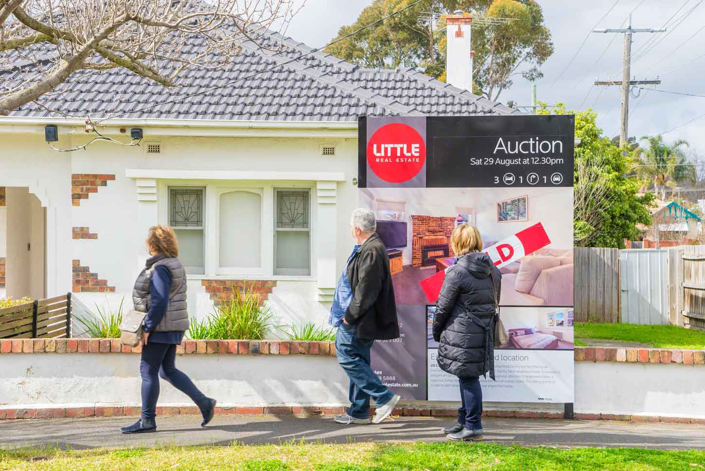 Auction sign on display outside a house in Melbourne