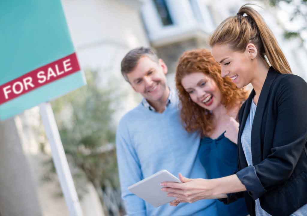 couple with real estate agent