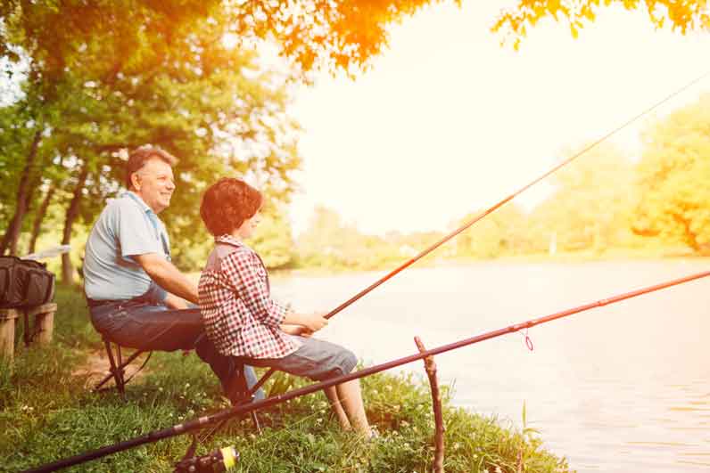 Grandpa and grandson fishing together.