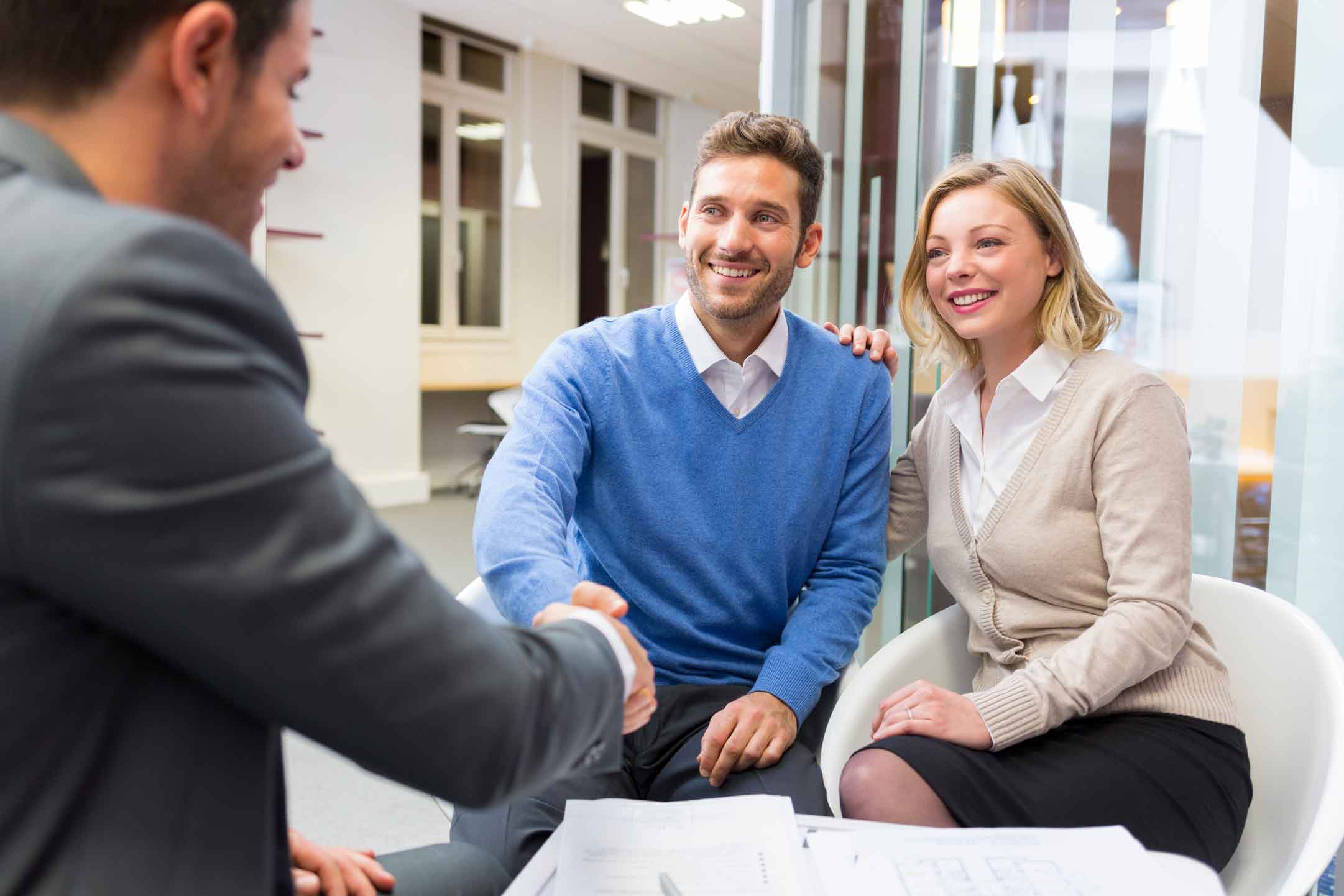 young couple choosing a real estate agent