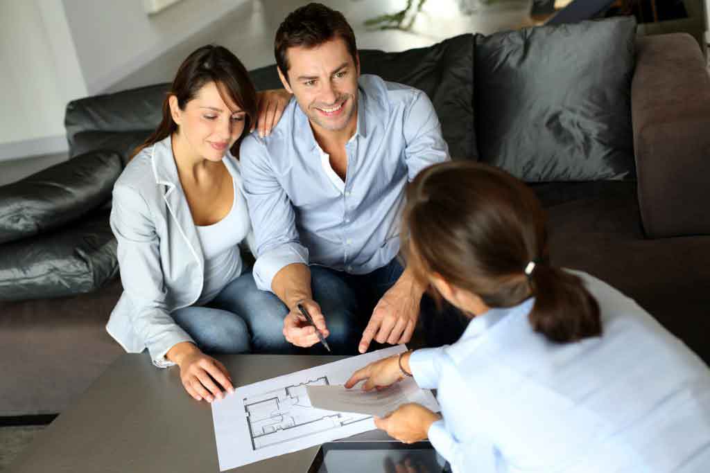 couple meeting real estate agent