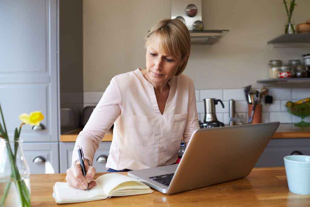 woman writing up a list