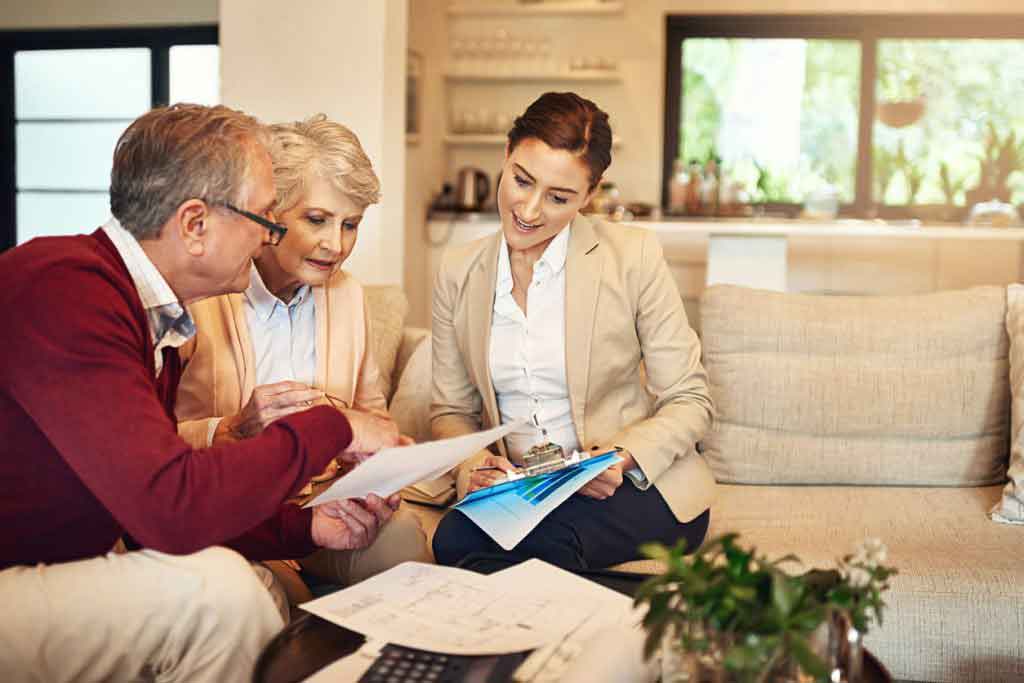 couple meeting real estate agent